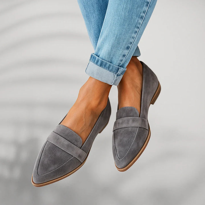Overhead view of slip-on loafers highlighting pointed toe silhouette and clean lines