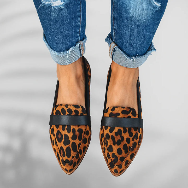 Full view of women's pointed toe loafers with low heel and refined slip-on design