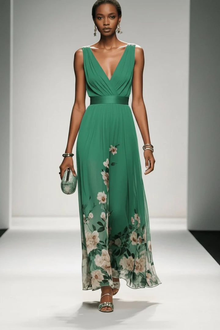 Detail of watercolour floral print blooming across hem of chiffon V-neck maxi gown