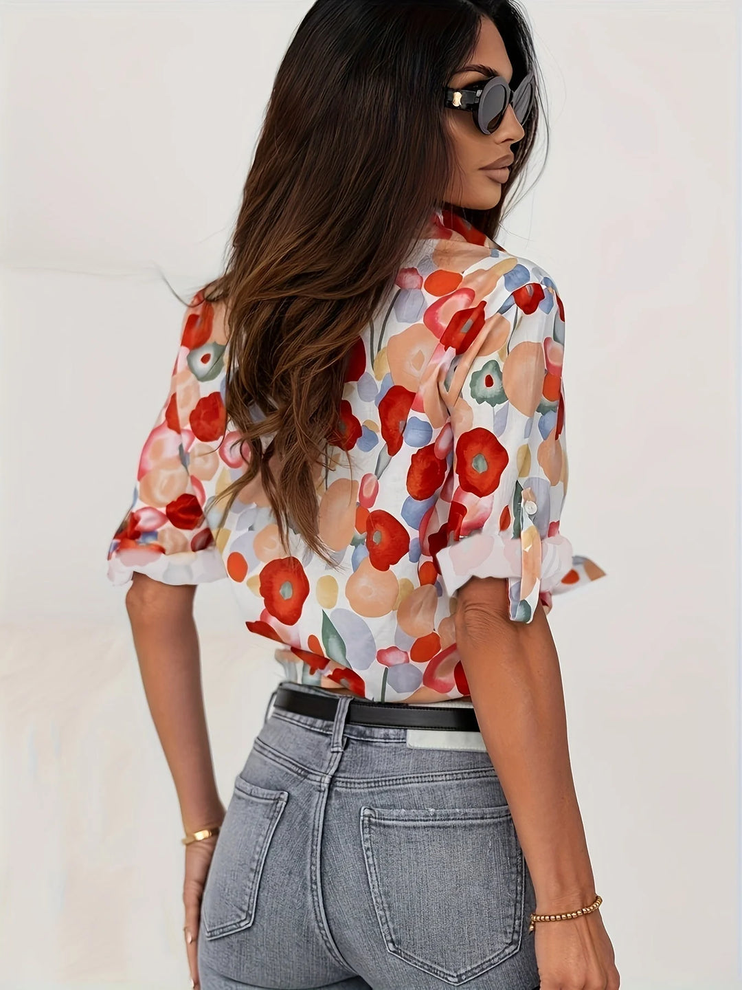 Side view of Women's Floral Print Long Sleeve Button-Up Shirt displaying relaxed regular fit and full-length sleeves