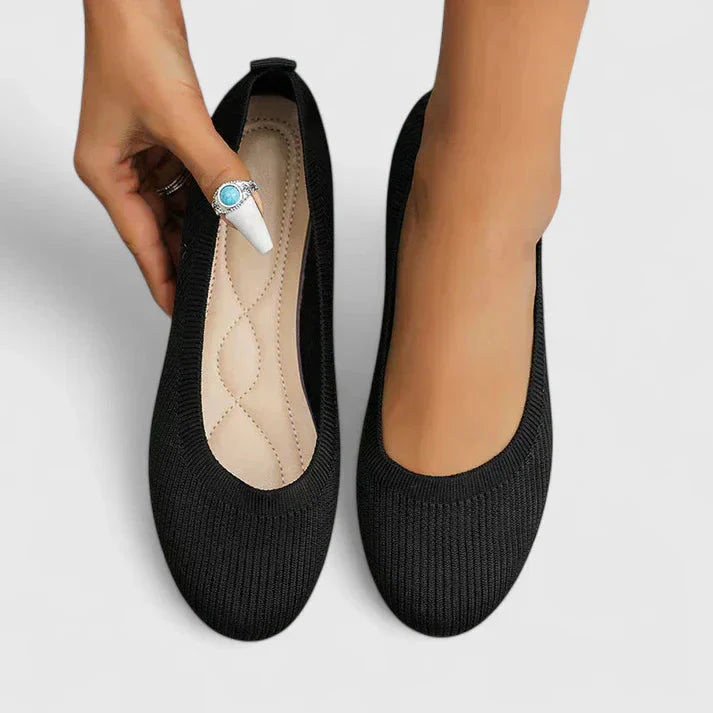 Women's orthopedic slip-on comfort shoes in black with cushioned footbed and elasticised sides for easy wear