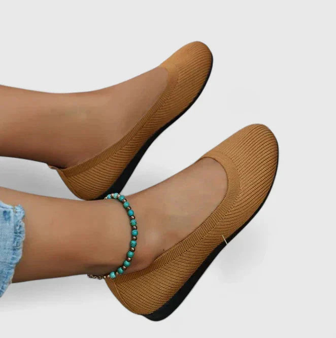 Detail of slip-on comfort shoes highlighting textured upper fabric and non-slip outsole construction