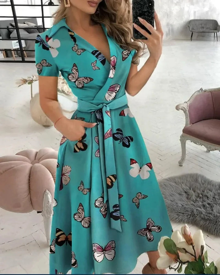 Side view showing the flattering drape and midi length of the A-line dress