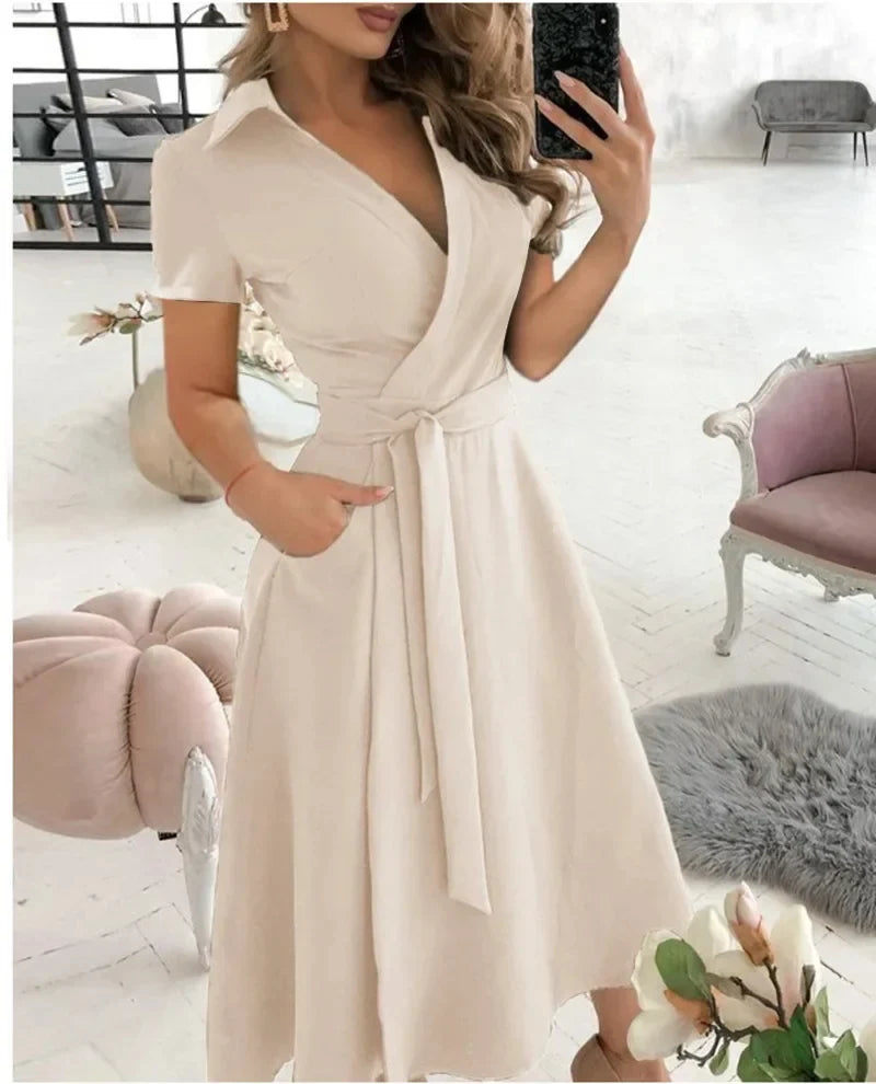 Lifestyle shot of the Women's Tie Waist A-Line Midi Dress in a contemporary setting