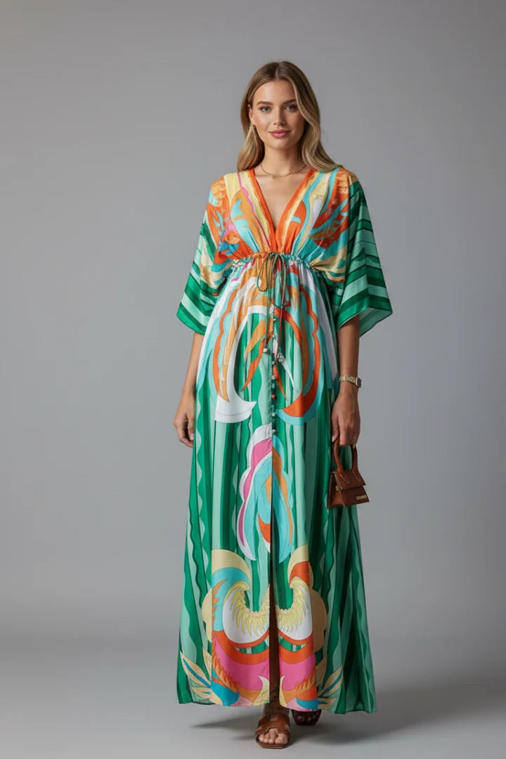Flowing maxi dress with adjustable drawstring waist and wide kimono sleeves in artistic print