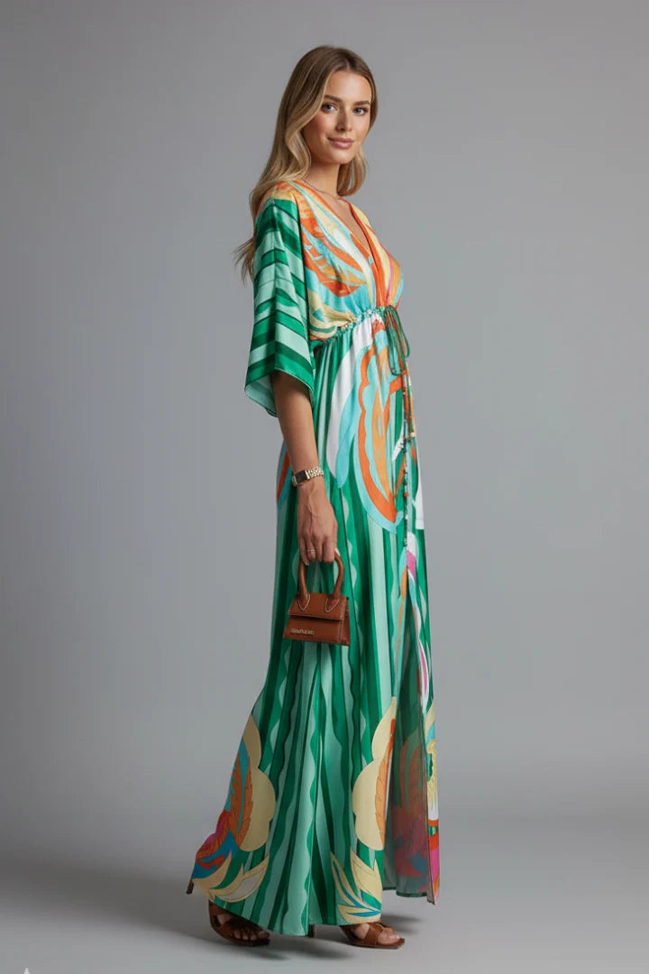 Resort wear maxi dress with flowing fabric and gathered waist detail