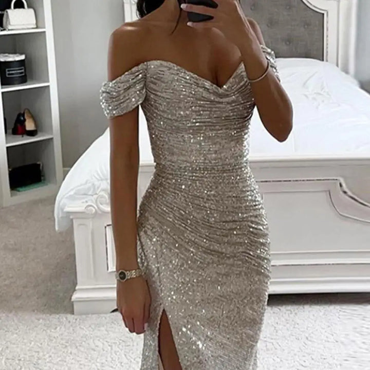 Off-shoulder sequin evening dress with floor-length hem and dramatic side slit for wedding guests