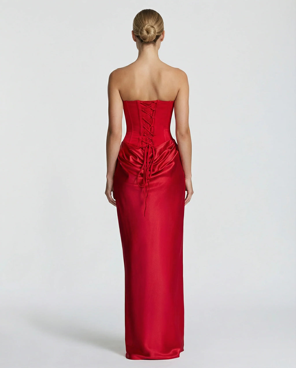 Model in black satin formal dress with strapless corset and floor-length hem