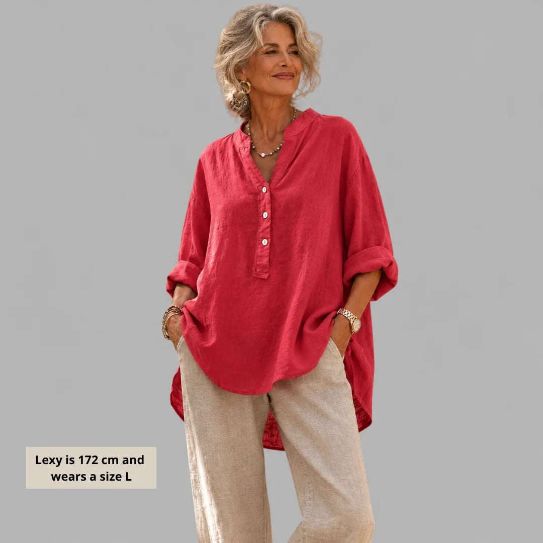 Woman wearing Elegant Cotton-Linen V-Neck Blouse in watermelon pink with relaxed fit and button-front detail