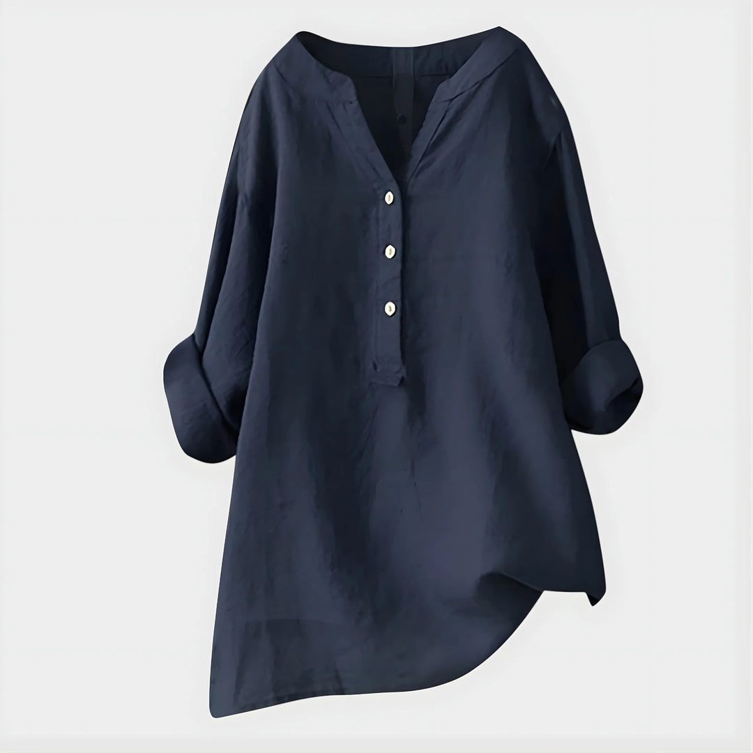 Detail of three-quarter sleeves and side slit on relaxed fit blouse