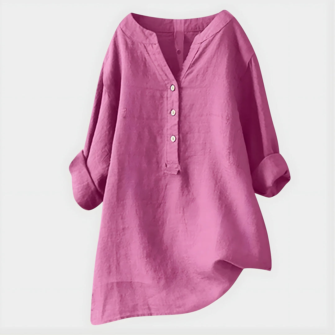 Woman wearing breathable V-neck blouse with button-front placket and comfortable drape