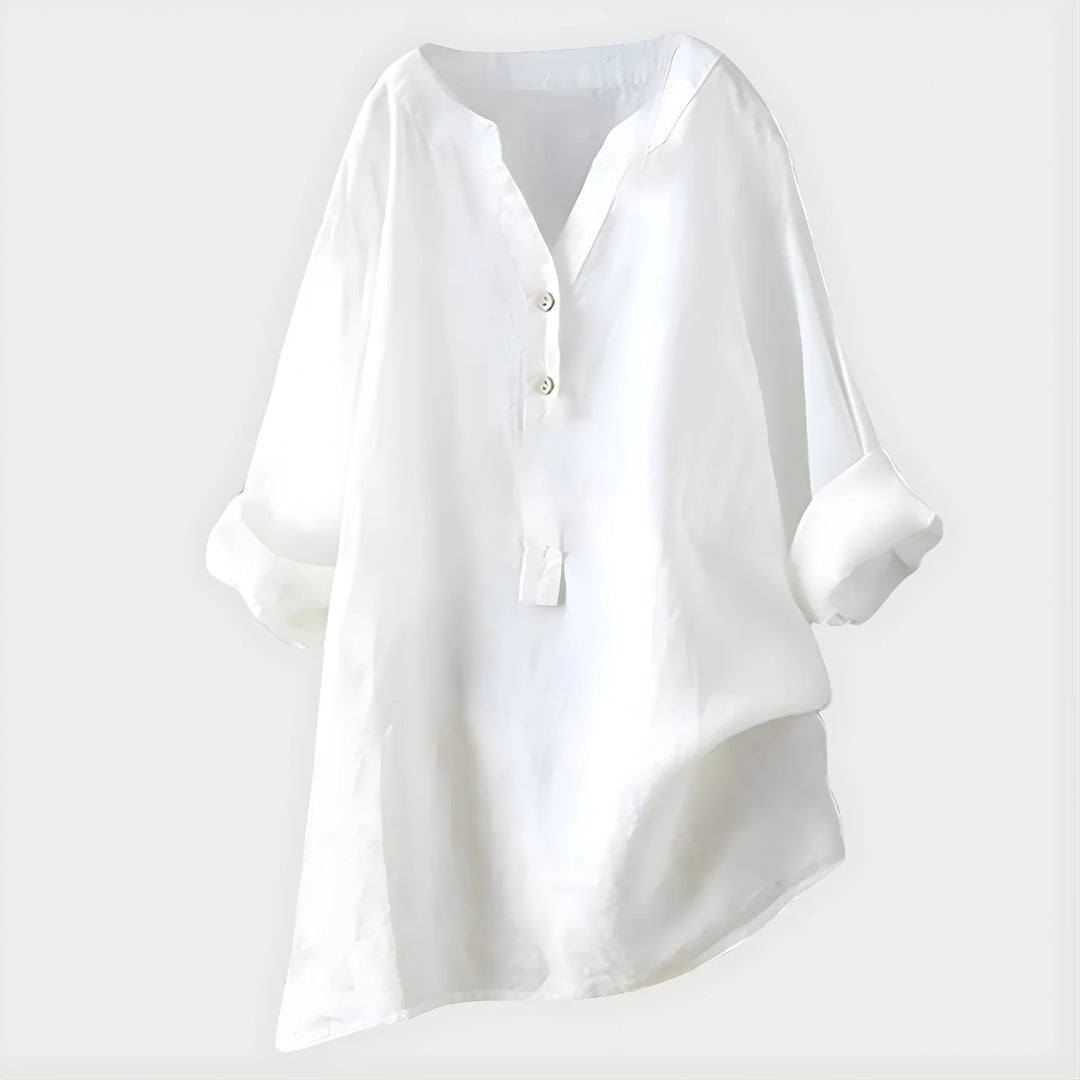 Detail shot of lightweight fabric drape and button-front closure on V-neck blouse