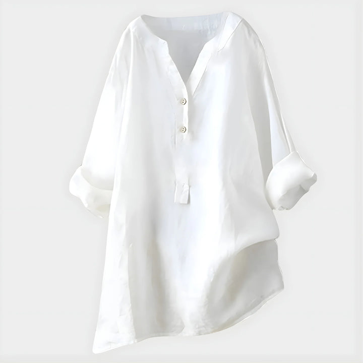 Detail shot of lightweight fabric drape and button-front closure on V-neck blouse