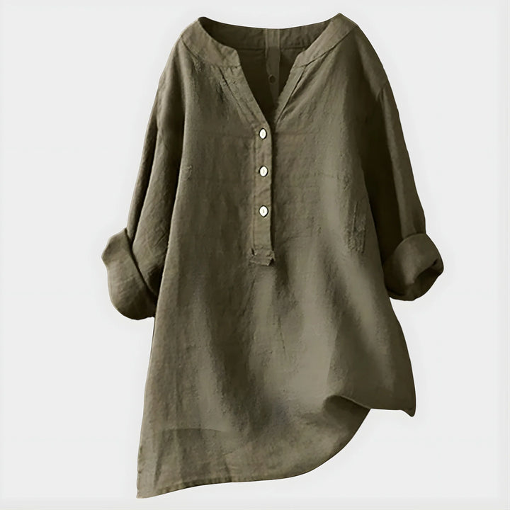 Close-up of soft fabric texture and V-neckline detail on casual blouse
