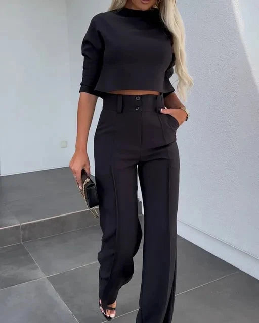 Front view of coordinated two-piece set with tailored cropped top and high-waist trousers for women