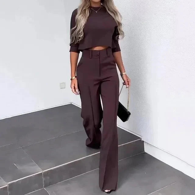 Back view of chic two-piece set featuring cropped top and straight-leg trousers