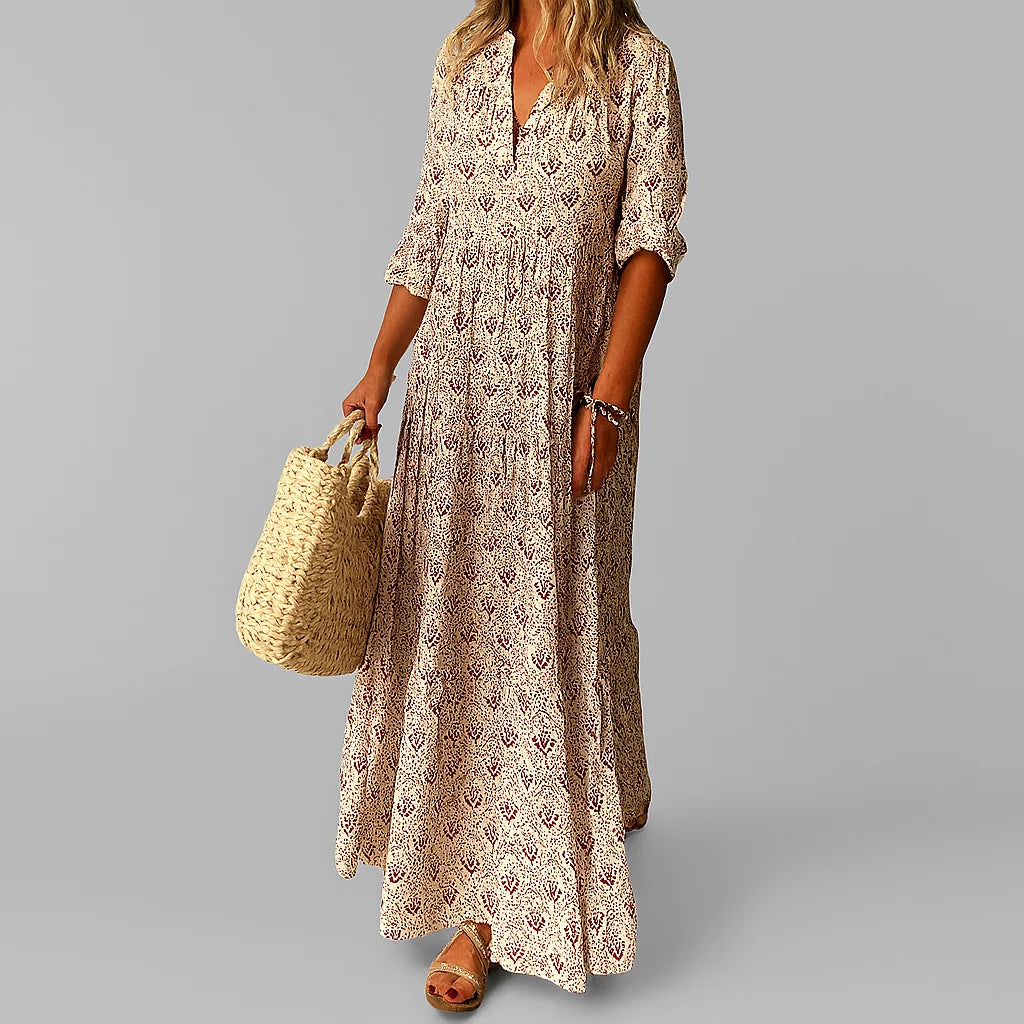 Close-up view of paisley pattern and gathered waist detail on maxi dress