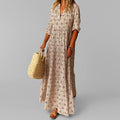 Close-up view of paisley pattern and gathered waist detail on maxi dress