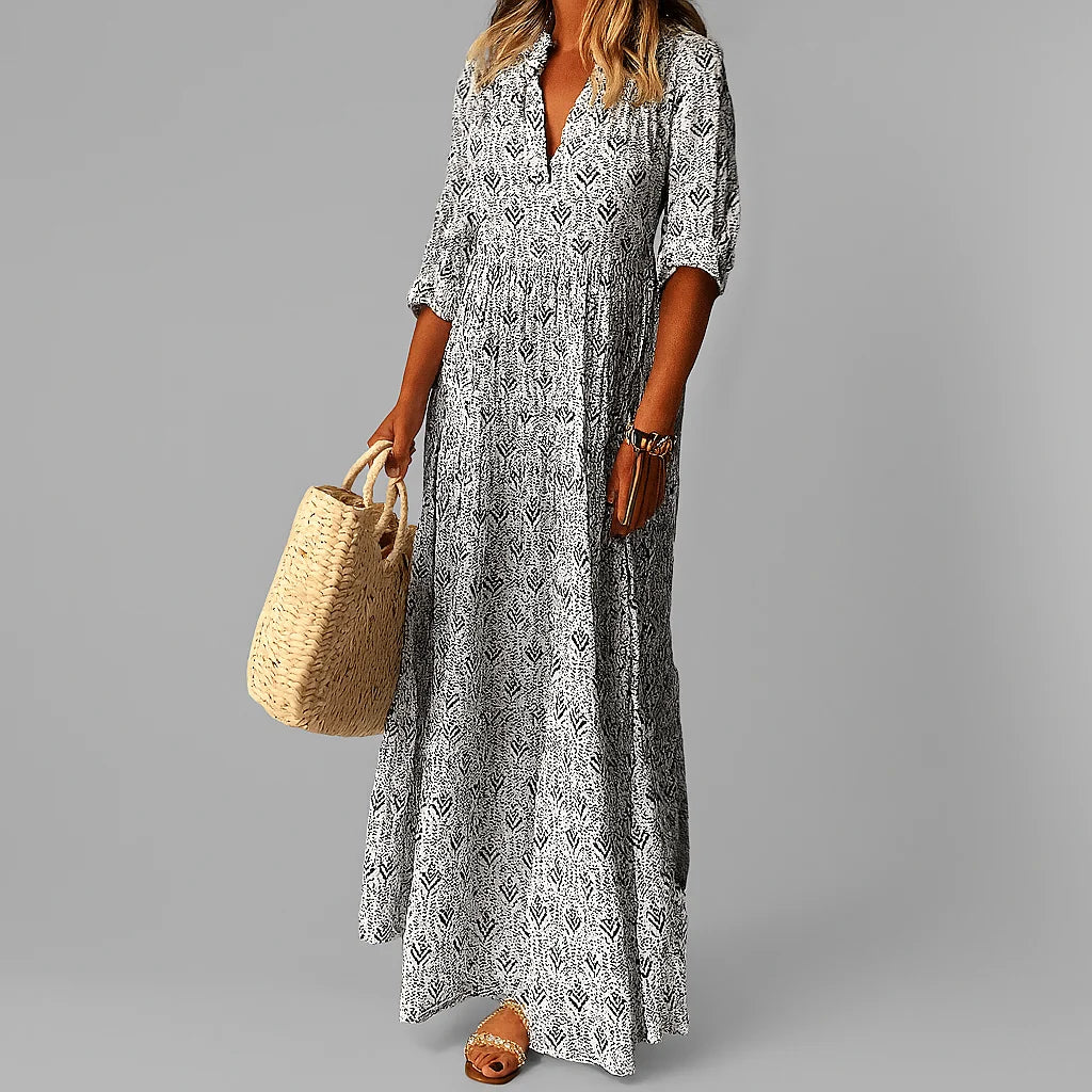 Side view showing floor-length silhouette and relaxed drape of paisley maxi dress