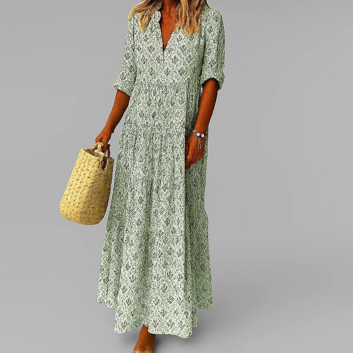 Full-length view of V-neck maxi dress with intricate paisley print and flowy skirt