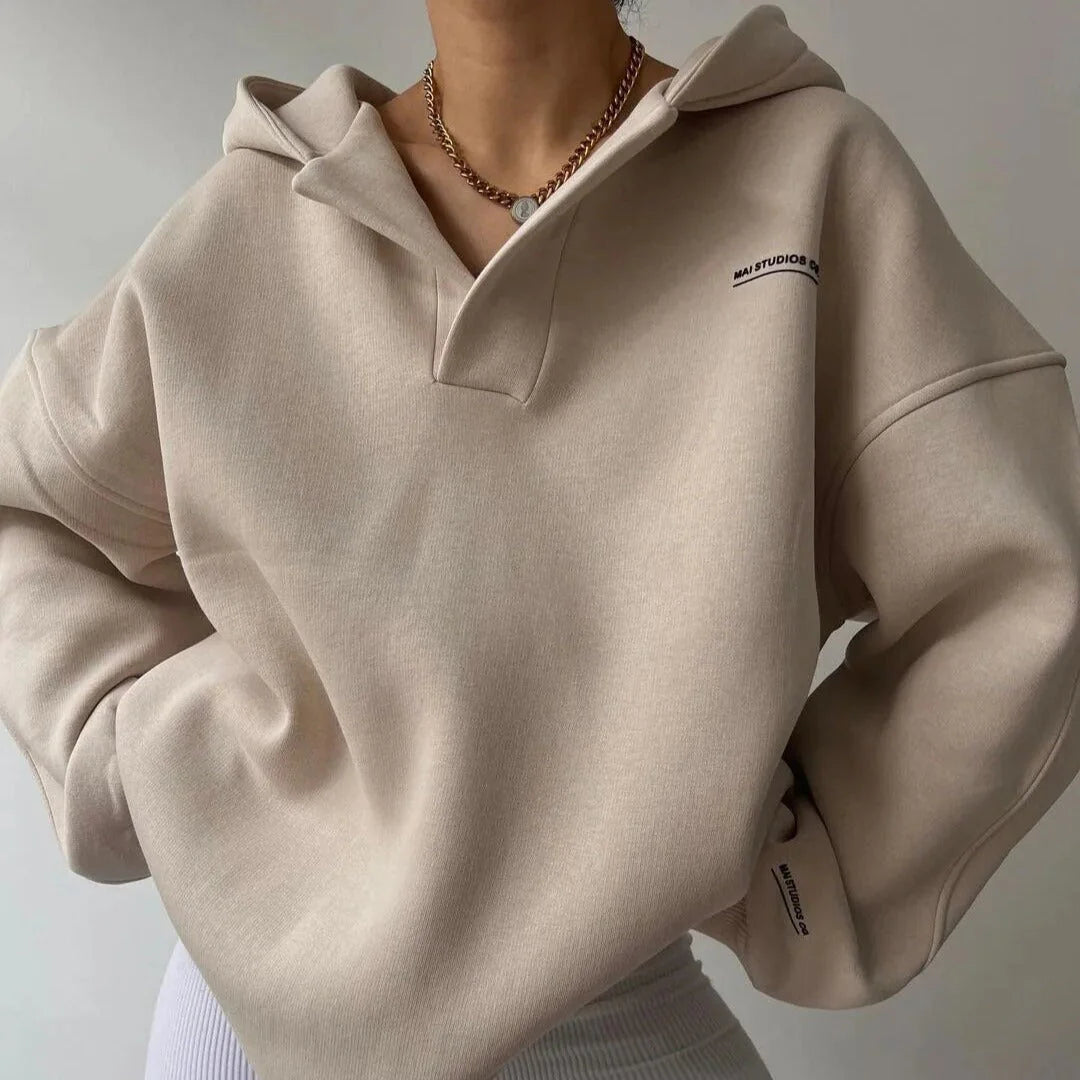 Side angle of the Oversized Lounge Hoodie For Women displaying ribbed cuffs and oversized sleeves