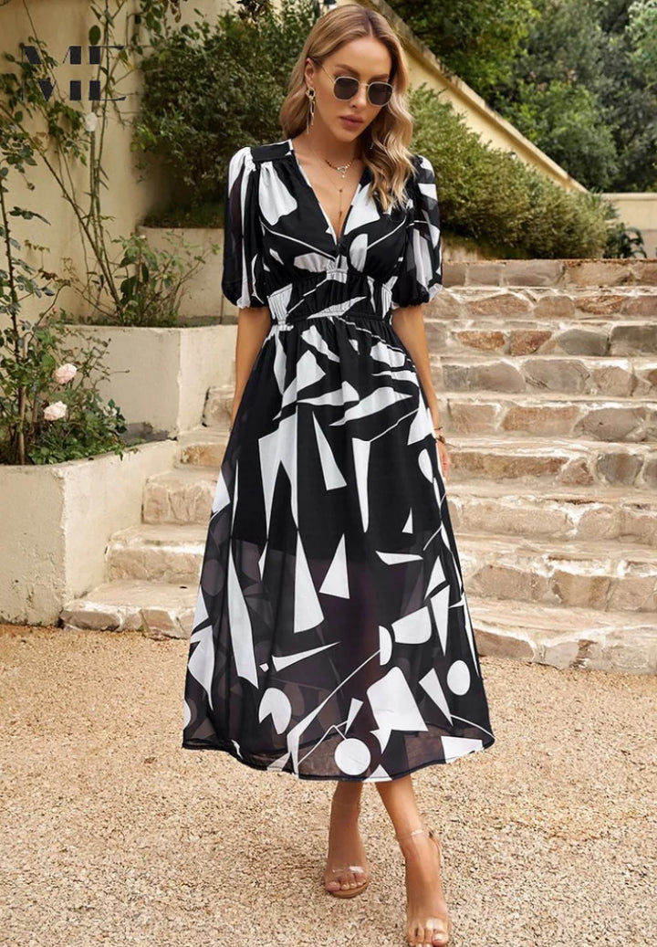 A-line midi dress showing waist definition and flowing skirt movement
