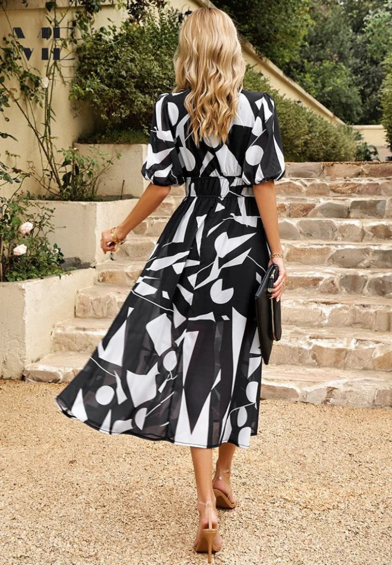 Woman wearing floral V-neck midi dress in outdoor garden setting