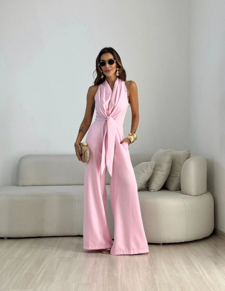 Halterneck jumpsuit with cinched waist and elongating wide-leg silhouette