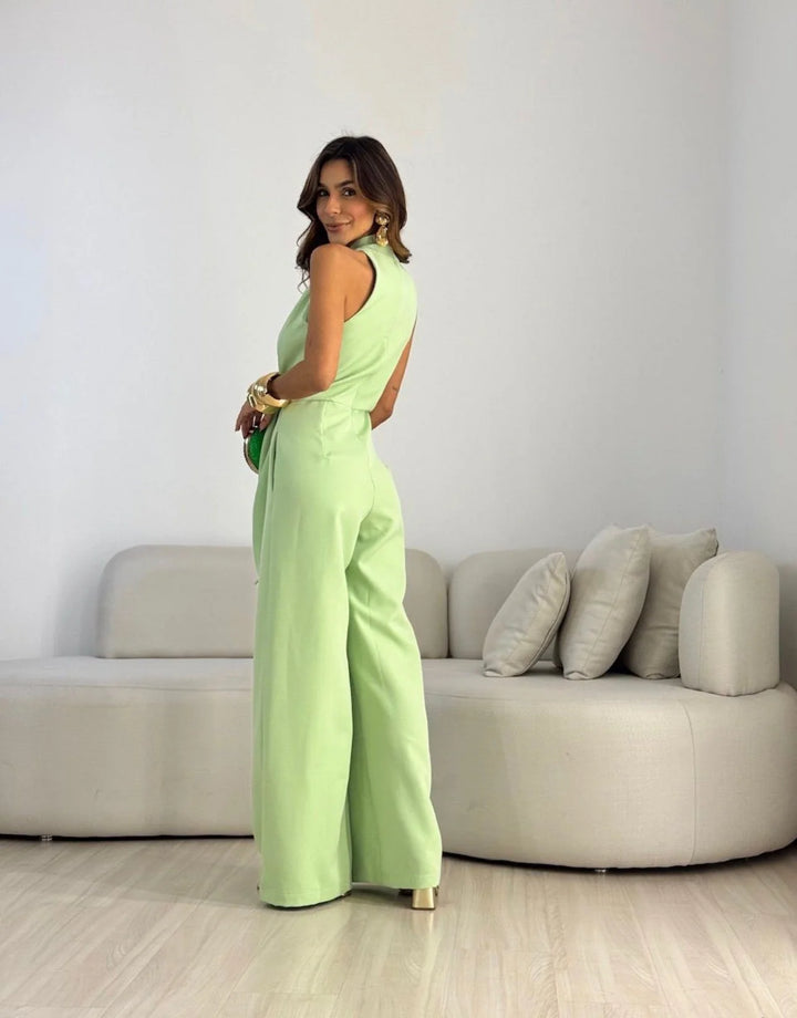 Halterneck jumpsuit featuring sleeveless design and wide-leg silhouette for warm-weather occasions