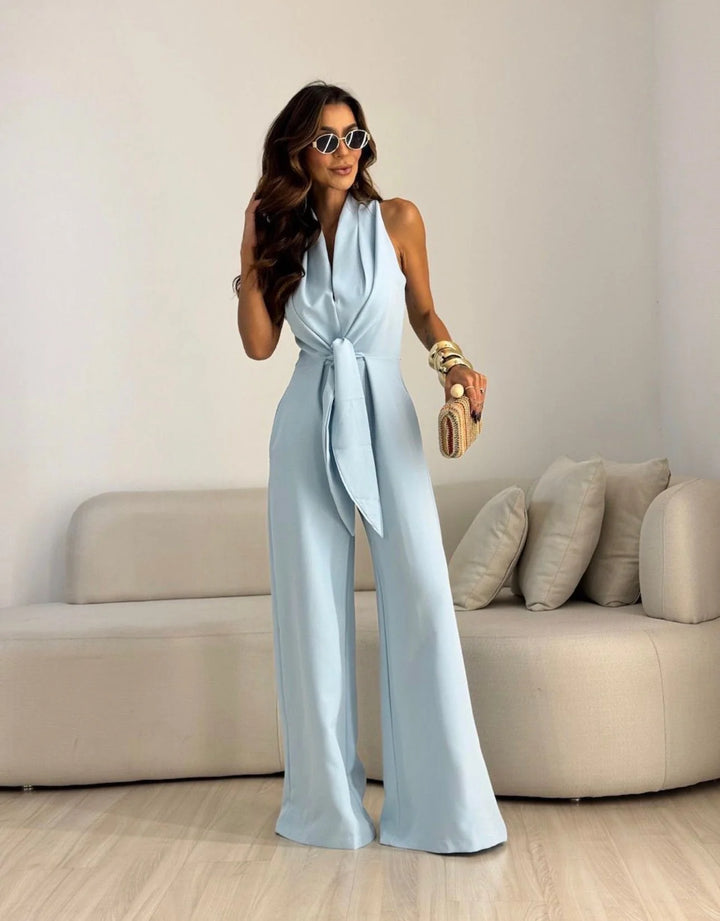 Wide-leg halterneck jumpsuit styled with heels and clutch for formal occasions