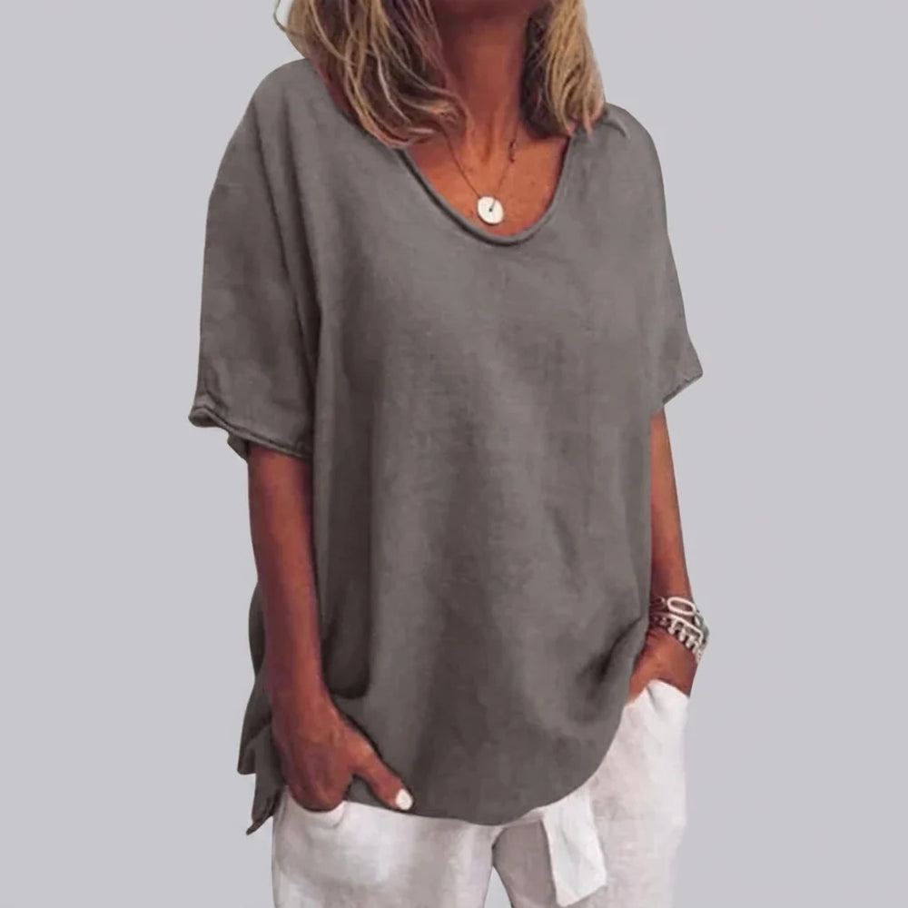 Close-up view of women's oversized v-neck tee showing relaxed fit and soft drape