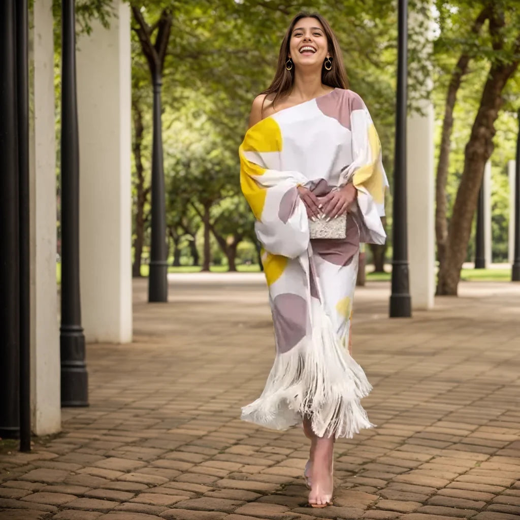 Close-up view of one shoulder wrap midi dress showing balloon sleeves and fringe detail