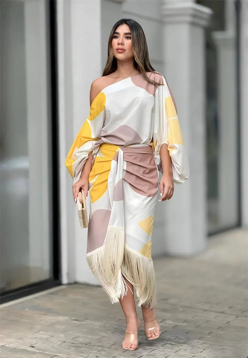 Detail shot of balloon sleeves and wrap silhouette on one shoulder midi dress