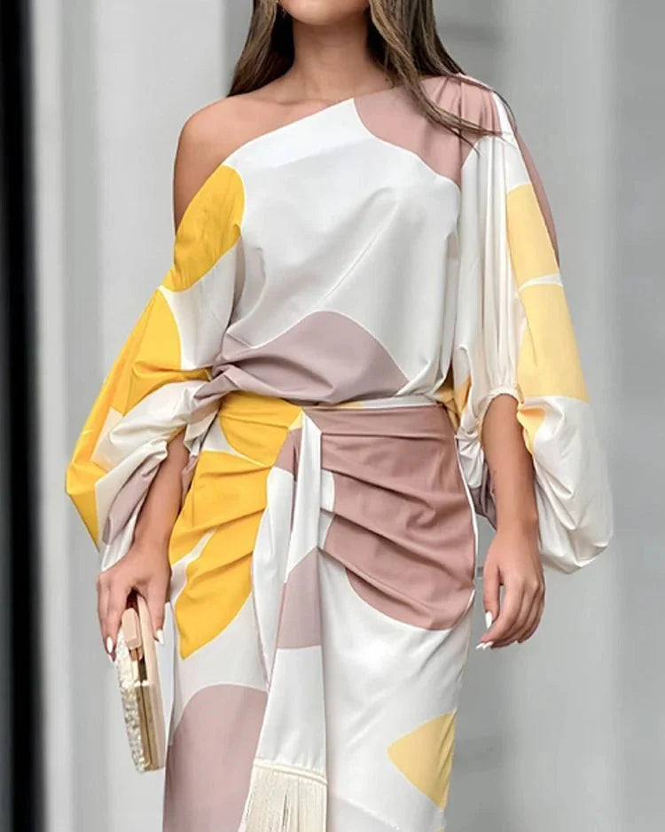 Back view of wrap midi dress showing tie closure and fringe hem detail