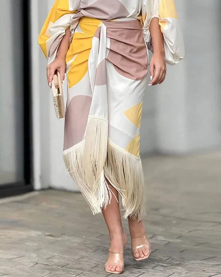 Close-up of geometric print pattern on one shoulder wrap midi dress