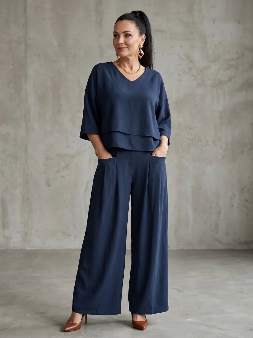 Women's wide leg pants set in navy with layered cropped top and high waisted trousers