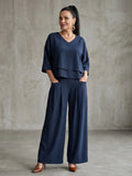 Women's wide leg pants set in navy with layered cropped top and high waisted trousers