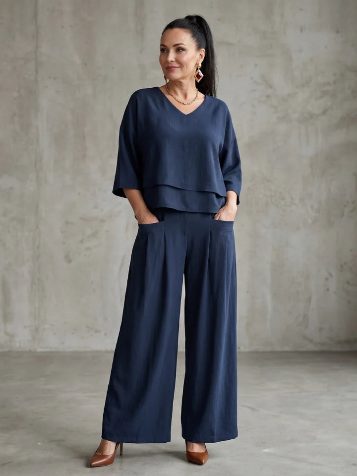Women's wide leg pants set in navy with layered cropped top and high waisted trousers
