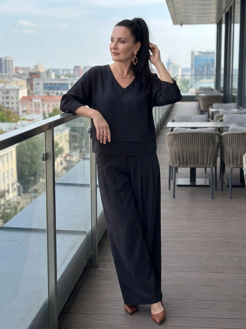 Side profile of wide leg pants set showing relaxed silhouette and tiered top detail