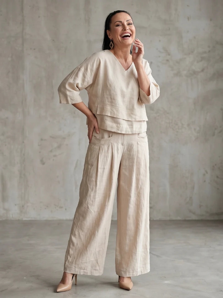 Full length view of navy co-ord set with patch pocket pants and V-neckline top