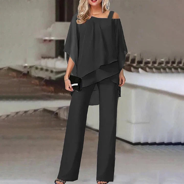 Women's layered two-piece set showing cascading chiffon-style overlay and relaxed wide-leg trousers