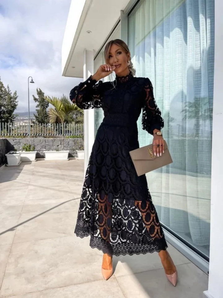 Woman wearing black Elegant French Lace Dress with long sleeves and midi-length skirt on outdoor terrace