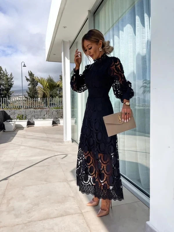 Full-length view of midi lace dress styled with heeled boots for formal occasion