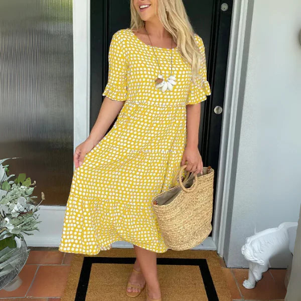 Side angle of polka dot tiered midi dress with round neckline and graduated tiers