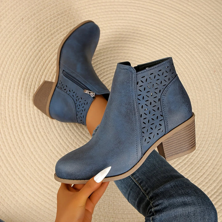 Women's ankle boots cutout detail with geometric perforations and stacked block heel in blue