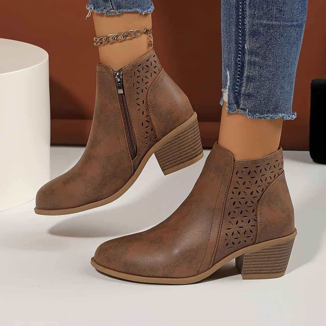 Women's ankle boots cutout detail in blue with laser-cut geometric pattern and block heel
