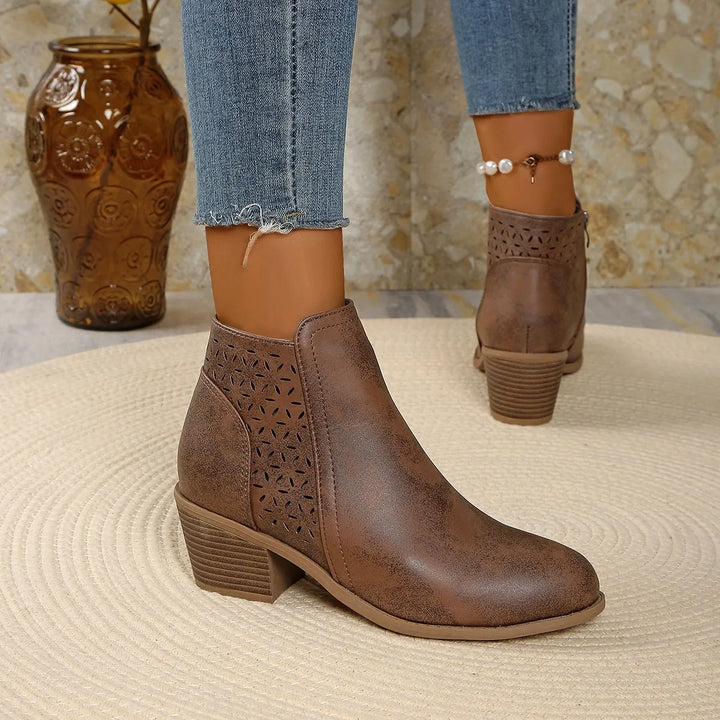 Women's ankle boots cutout detail styled for casual wear with cropped trousers