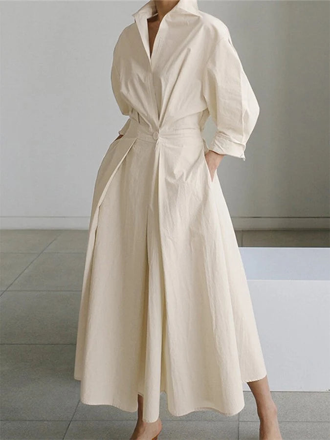 Side view of collared midi dress showing A-line silhouette and flowing skirt