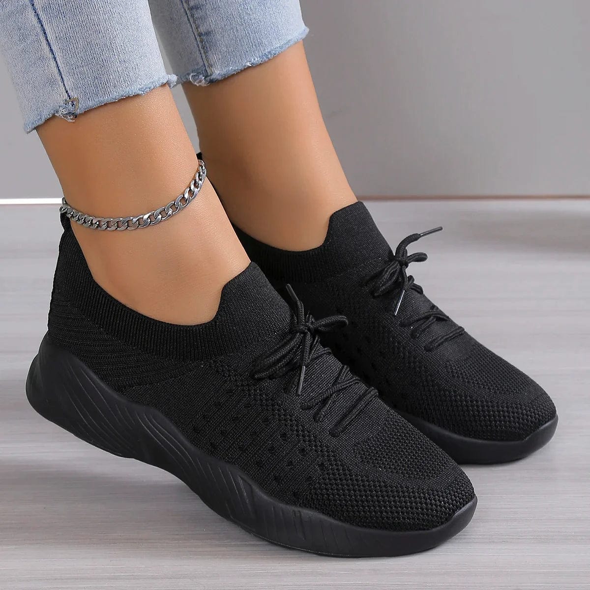 Detail of knitted upper construction on women's orthopedic support shoes with breathable mesh zones