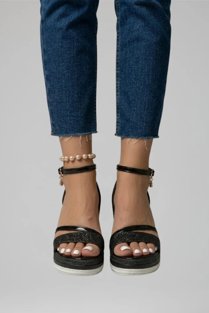 Side view of women's espadrille wedge sandals showing woven platform and open-toe design